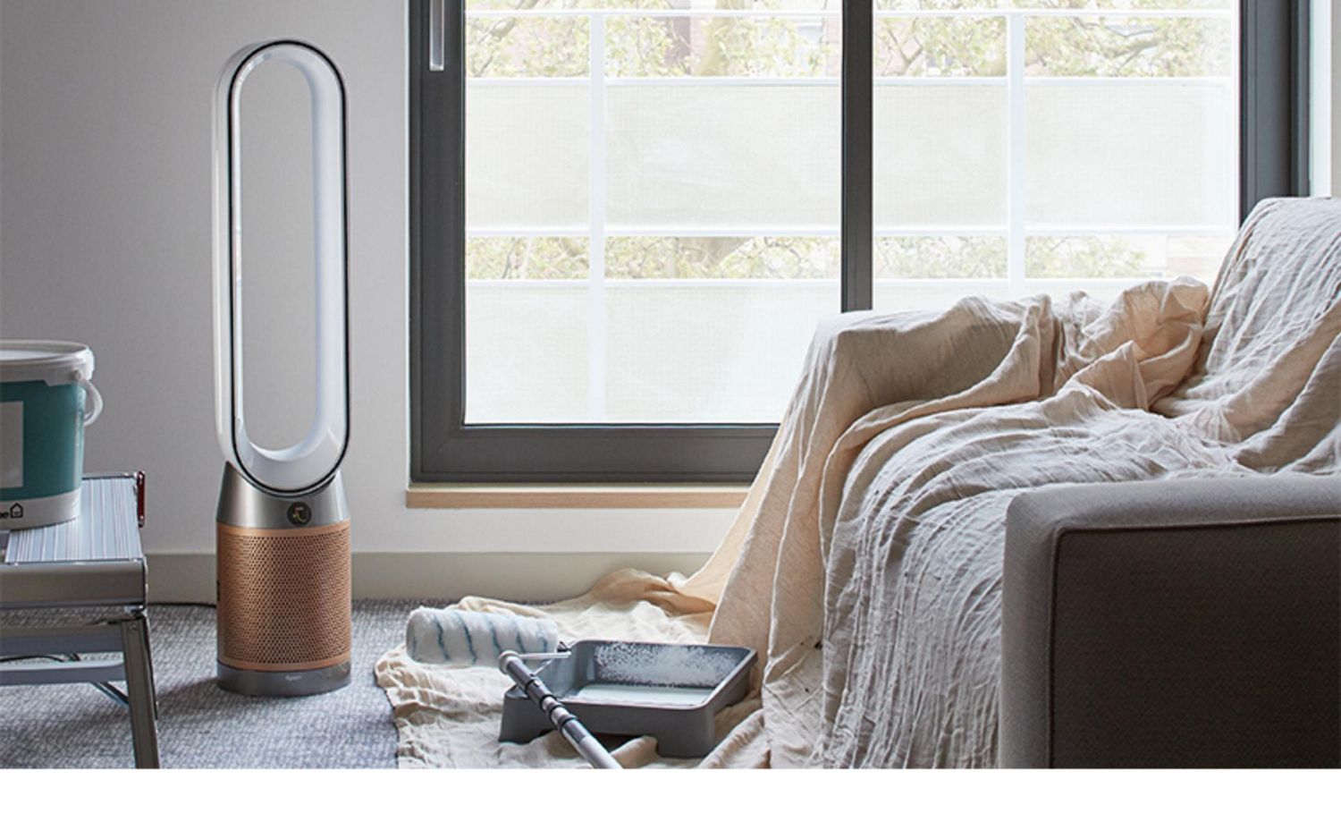 A Dyson purifier in a living room being painted.